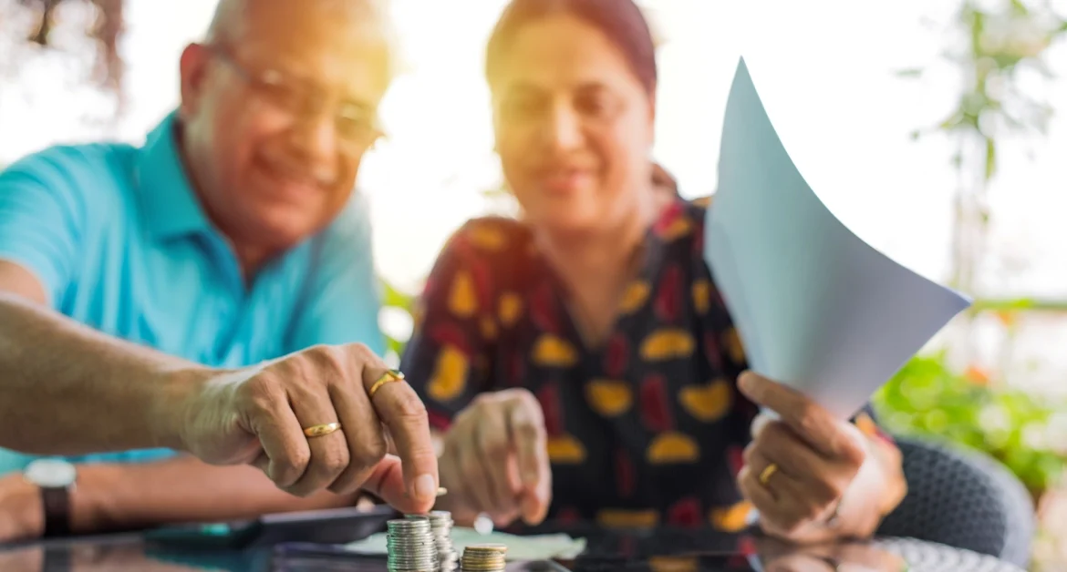 Senior Indian couple saving money by removing tax penalties with penalty abatement services by American Tax Service